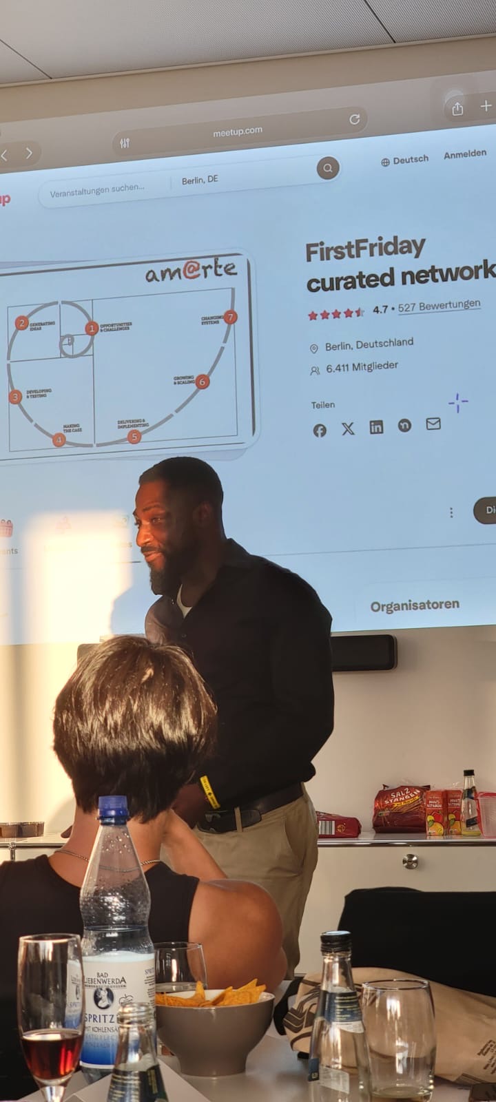 Temitope Okunjolu presenting at FirstFriday Berlin